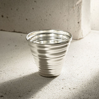 Elegant handmade copper tumbler with a serrated form and 250ml capacity, perfect for beverages.