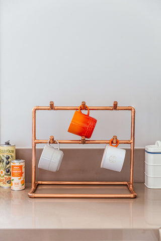 Copper Cup Stand – Industrial Display with Artisanal Charm
